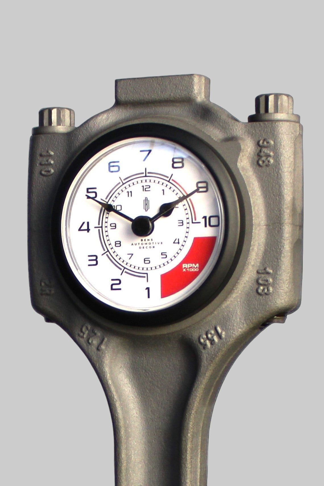 Piston with a clock face on a reflective surface