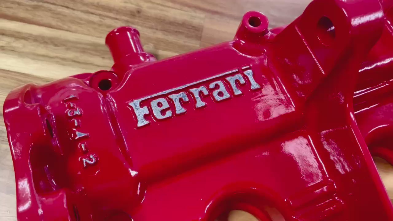 Video of a wall mounted coat and key rack made from a Ferrari 308 engine valve cover finished in red