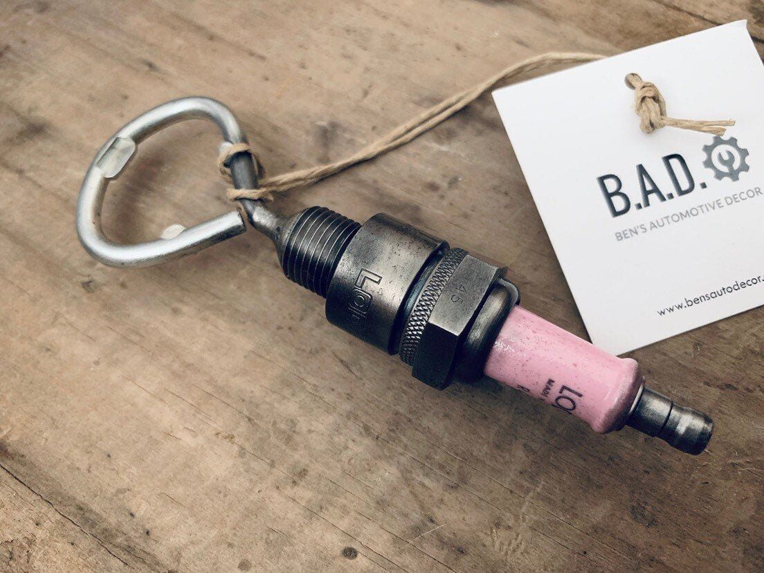 Bottle opener handcrafted from a genuine Rolls Royce engine spark plug.