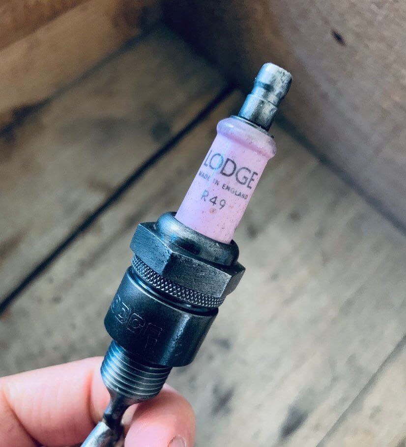 Bottle opener handcrafted from a genuine Rolls Royce engine spark plug.