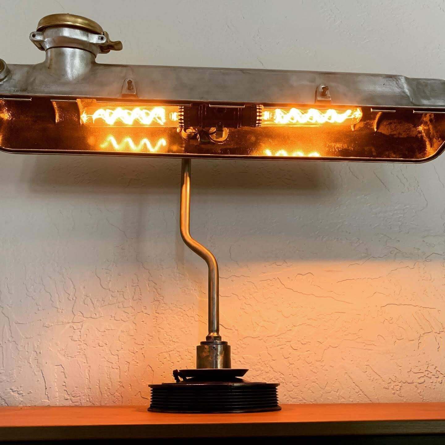Tabletop lamp handcrafted from a genuine polished car valve cover, engraved cap and LED lightbulbs.