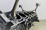 Load image into Gallery viewer, Close-up view of a Mercedes V12 engine block coffee table, finished in black and silver.
