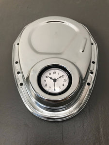 Clock made from a Chevrolet timing cover, finished in silver.