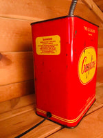 Load image into Gallery viewer, Close-up view of a lamp made out of a red and yellow vintage gas can with an incandescent lightbulb.
