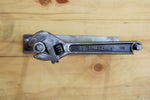 Load image into Gallery viewer, Wrench and nut toilet paper holder, finished in gunmetal gray.
