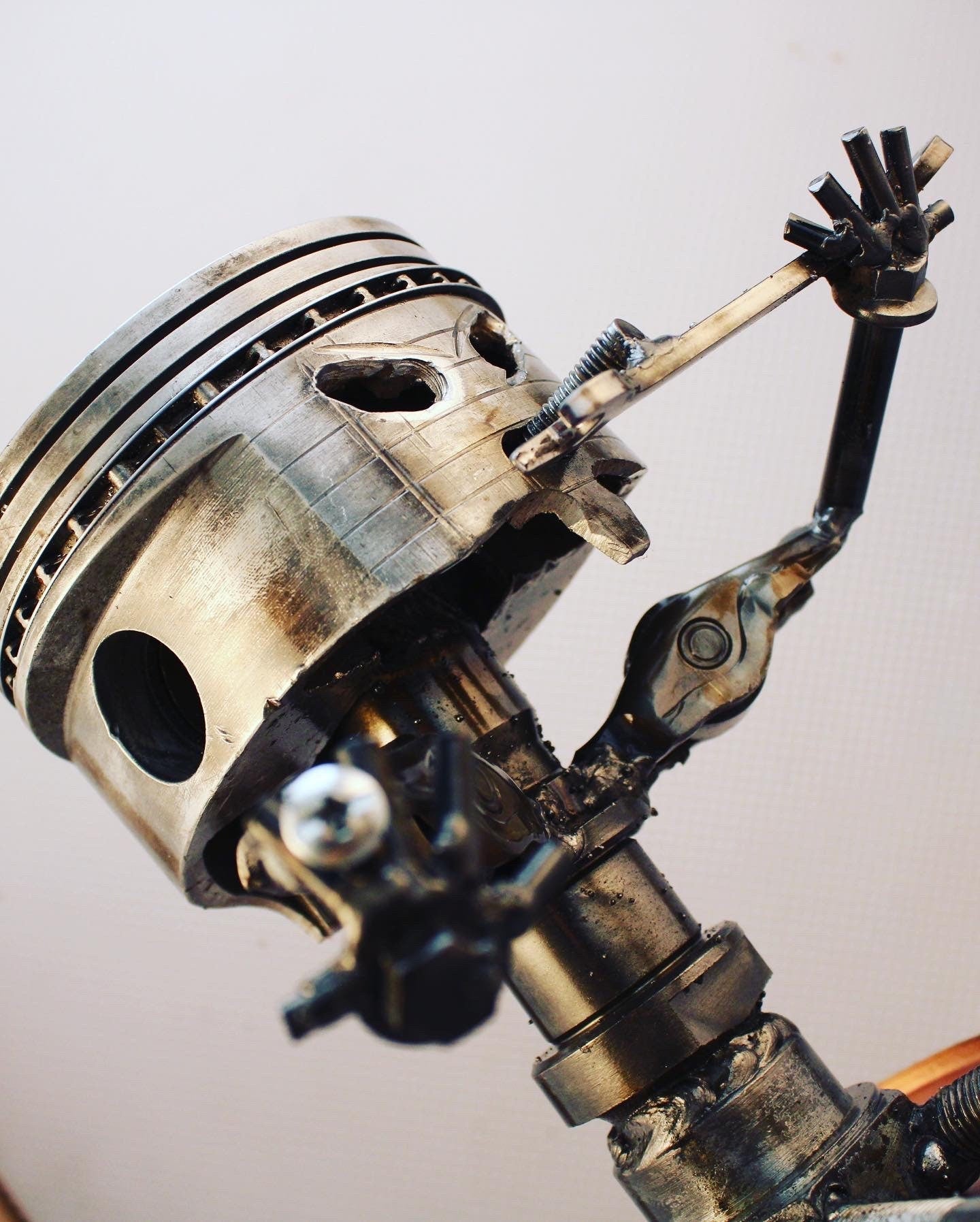 Sitting Piston Man Car Part Sculpture - Automotive Figurine, Unique Steampunk Desk Art - Ben's Auto Decor