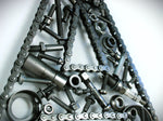 Load image into Gallery viewer, Close-up view of a letter A made out of real car parts, outlined with a timing chain.
