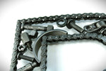 Load image into Gallery viewer, Close-up view of a letter B made out of real car parts, outlined with a timing chain.
