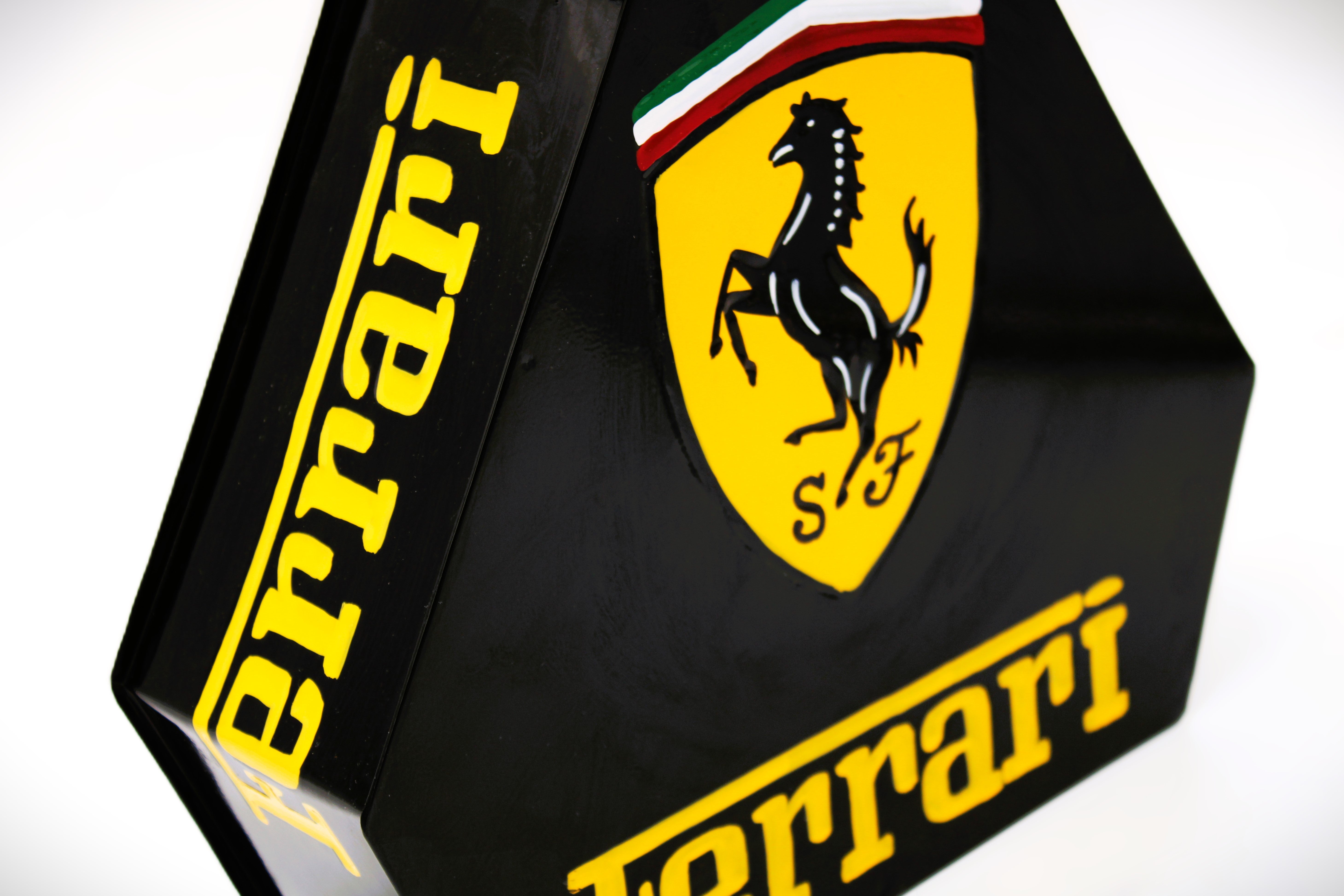 Black and yellow painted gas can with the Ferrari logo displayed on all sides.