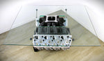 Load image into Gallery viewer, Ford FR9 engine block coffee table with a square glass top, finished in black and silver.
