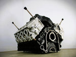 Load image into Gallery viewer, Ford FR9 engine block coffee table without its glass top, finished in black and silver.
