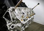 Load image into Gallery viewer, Close-up view of a Ford FR9 engine block coffee table, finished in black and silver.
