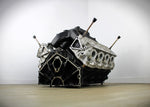 Load image into Gallery viewer, Ford FR9 engine block coffee table without its glass top, finished in black and silver.
