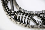 Load image into Gallery viewer, Close-up view of a letter G made out of real car parts, outlined with a timing chain.
