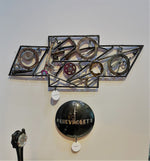 Load image into Gallery viewer, Chevrolet logo art made entirely out of real car parts, outlined with timing chain.
