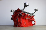 Load image into Gallery viewer, Ferrari engine block coffee table finished in red without its glass top.
