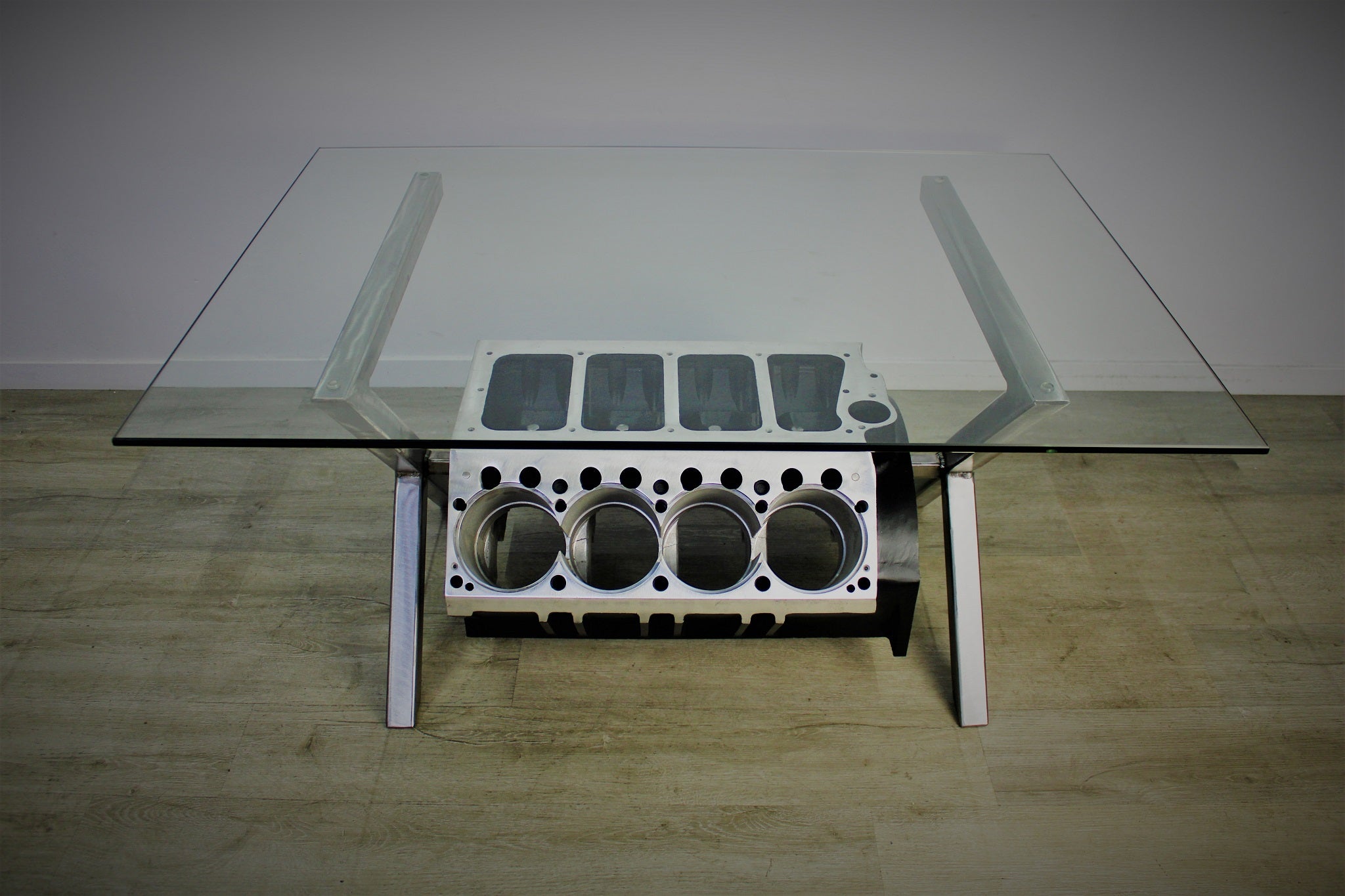Top Fuel aluminum engine block coffee table finished in black and silver with a rectangular glass top.