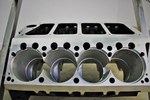 Close-up view of a Top Fuel aluminum engine block coffee table finished in black and silver.
