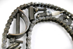 Load image into Gallery viewer, Close-up view of a letter Q made out of real car parts, outlined with a timing chain.
