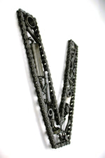 Load image into Gallery viewer, Close-up view of a letter V made out of real car parts, outlined with a timing chain.
