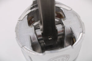 Close-up view of the base of a polished car piston clock, engraved with the Ben's Automotive Decor logo.
