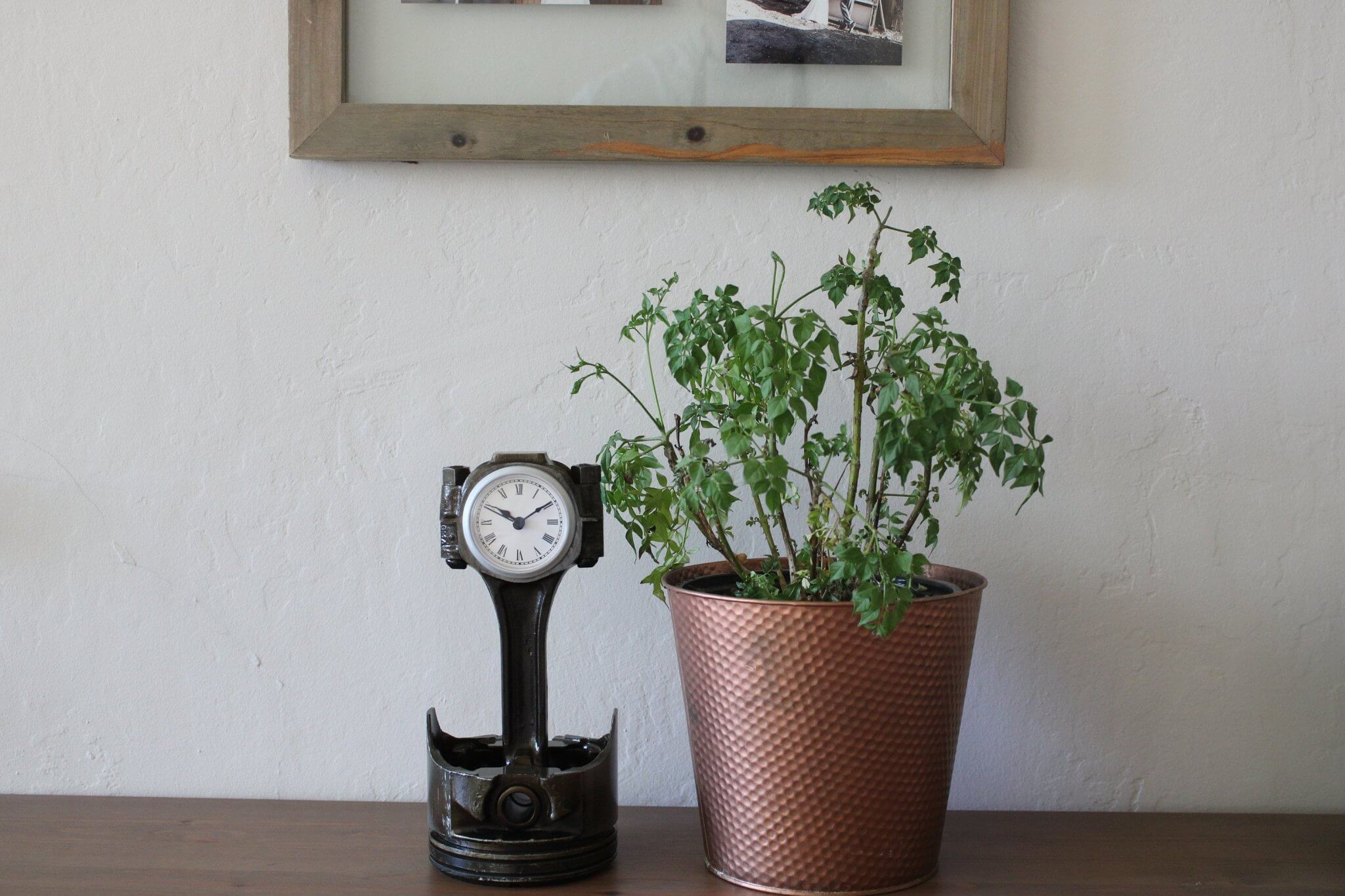 Tabletop clock handcrafted from a genuine Chevrolet car engine piston with various colored finishes and a standard clock face.