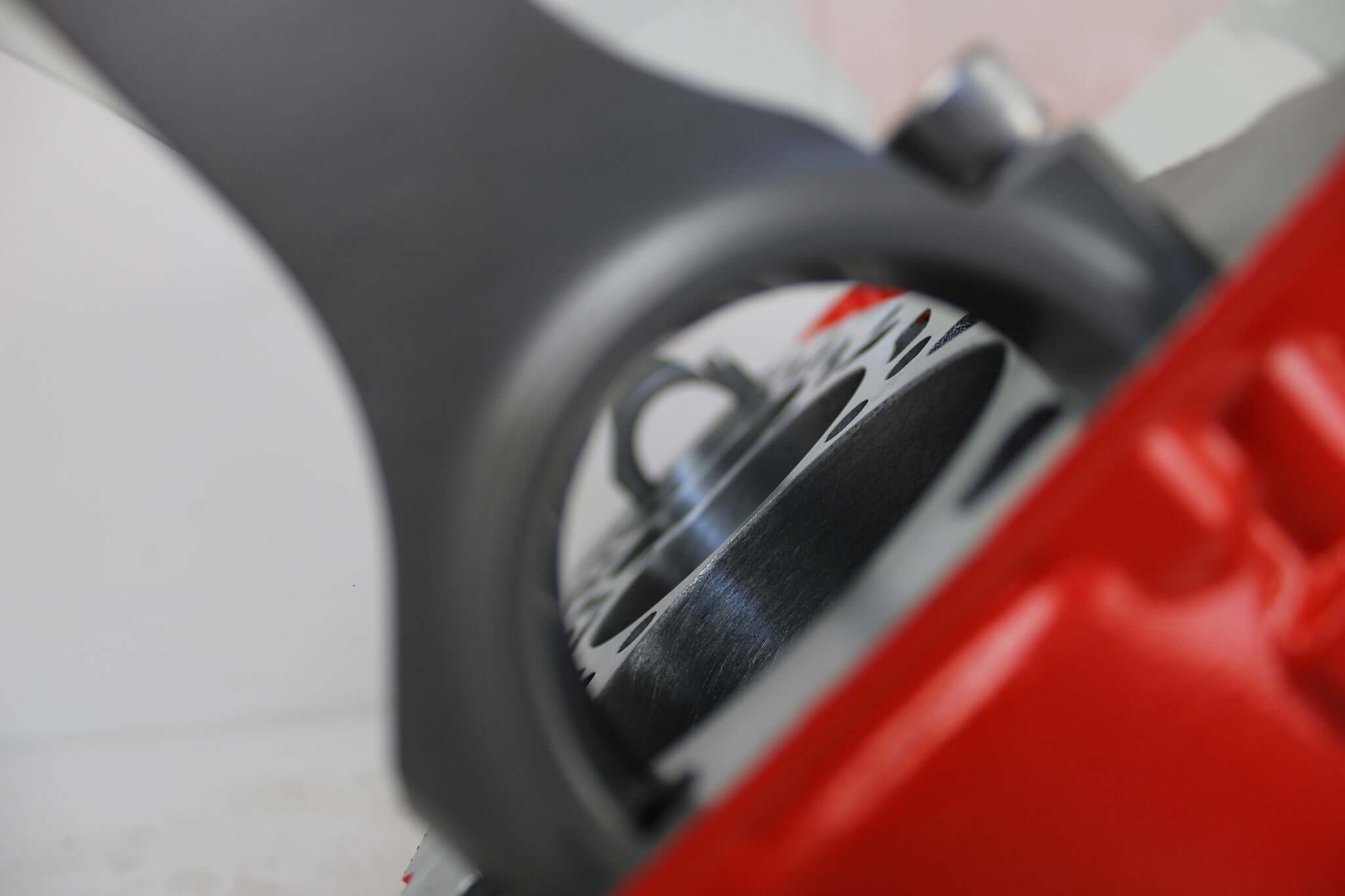 Coffee tables handcrafted from genuine car engines with various colored finishes, logos displayed, and glass top shapes.