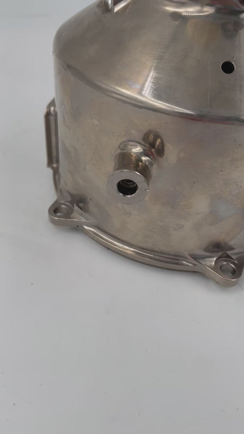 Video of a lamp with no shade made from a McLaren car's clutch housing in a shiny finish.