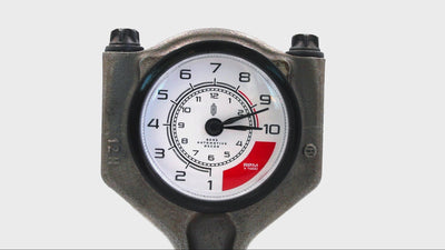 Video of a clock ticking that was made from a car piston with a custom RPM clock face.