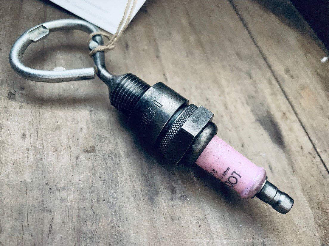 Bottle opener handcrafted from a genuine Rolls Royce engine spark plug.