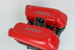 Load image into Gallery viewer, Birds-eye view of a Ferrari intake manifold table without its glass top, finished in red with the Ferrari logo displayed on both sides.
