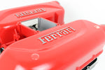 Load image into Gallery viewer, Close-up view of a Ferrari intake manifold table without its glass top, finished in red and displaying the Ferrari logo on both sides.
