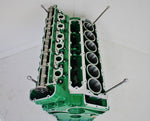 Load image into Gallery viewer, Birds-eye view of a Jaguar V12 engine block coffee table, finished in British Racing Green without its glass top.
