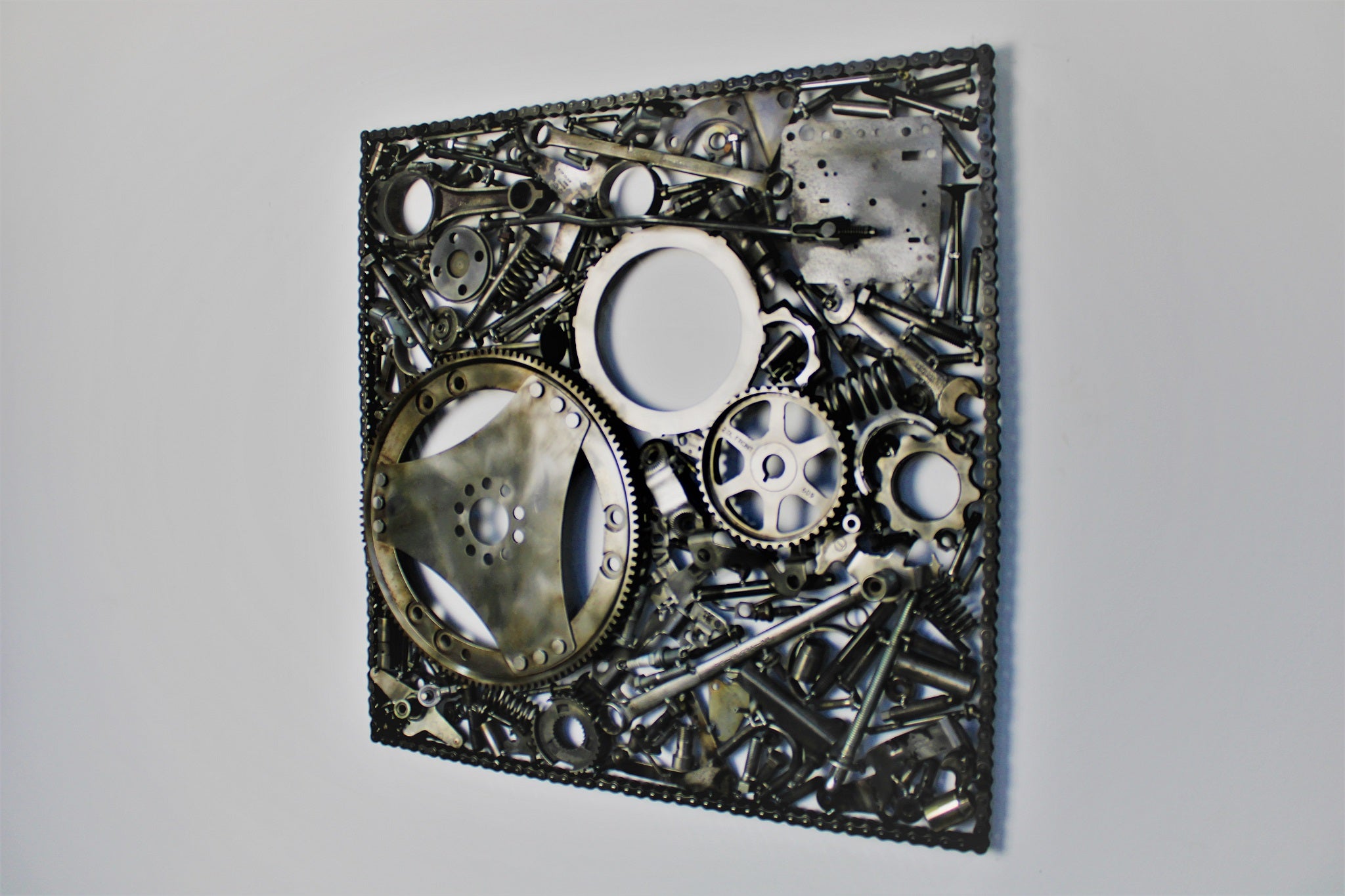 Automotive wall art made out of real car parts, 24 by 24 inch square wall hanging