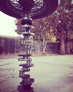 Pub table made from a tire and crankshaft.