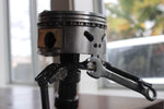Load image into Gallery viewer, Close-up view of a piston man car part sculpture holding a wrench.
