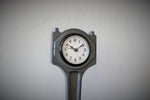 Load image into Gallery viewer, Close-up view of a piston clock made out of a Jaguar car&#39;s piston, finished in gunmetal gray.
