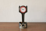 Load image into Gallery viewer, A piston clock made out of a Jaguar car&#39;s piston with a red clock ring and patina finish.

