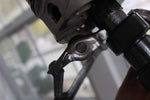 Load image into Gallery viewer, Close-up view of a piston man car part sculpture.
