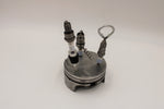 Load image into Gallery viewer, Spark plug bar set including a wine stopper, corkscrew and bottle opener, all made from car spark plugs and in a car piston holder.

